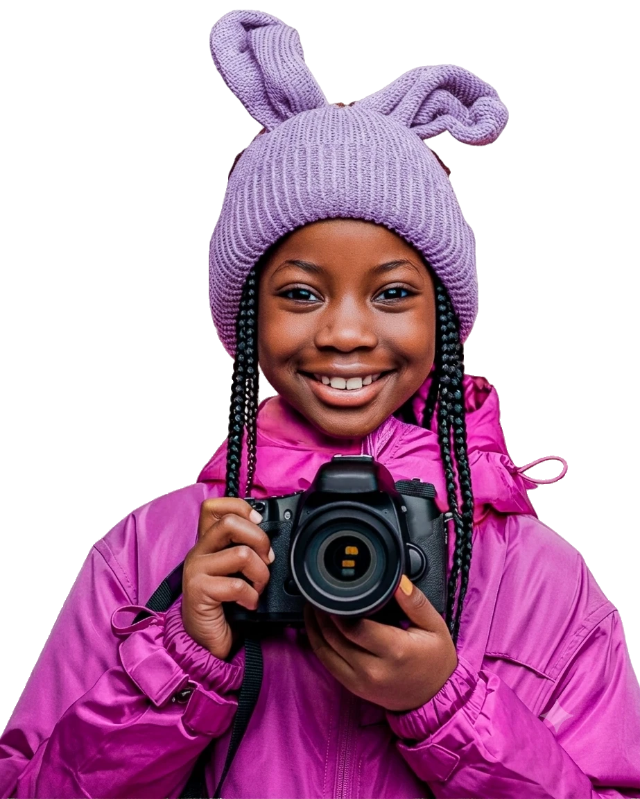 Young student holding a camera, smiling